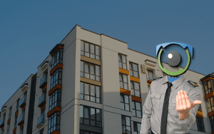 EyeQ’s mascot Vigil in a security uniform, standing in front of a modern multi-story building with large windows and balconies, representing AI-powered security solutions for multi-tenant properties and apartment complexes.