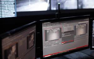 Security monitoring station displaying live video feeds, highlighting the difference between time-lapse cameras and live monitoring systems for real-time security.