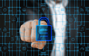 Businessman pressing a digital lock icon on a virtual touchscreen interface, symbolizing cybersecurity and data protection across connected networks.