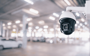 Pan tilt surveillance camera monitoring a large indoor parking garage, demonstrating flexible coverage for dynamic environments.