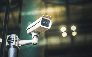 Multiple mounted CCTV units on a single pole forming a commercial IP camera system designed for wide area monitoring of business facilities.